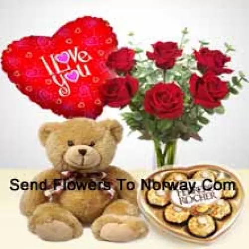 7 Rose rosse con alcune felci in un vaso di vetro, un carino orsacchiotto marrone alto 14 pollici, 8 pezzi di Ferrero Rocher a forma di cuore e un palloncino "Ti Amo"