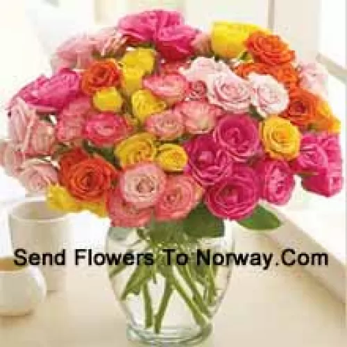 37 Mixed Colored Roses With Some Ferns In A Glass Vase