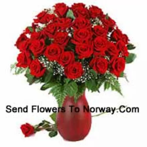 40 Red Roses And Seasonal Fillers In A Glass Vase