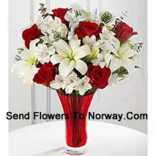 This Bouquet?is a gorgeous expression of yuletide joy and elegance. Red roses pop against a background of white Asiatic lilies and Peruvian lilies lovingly arranged in a red designer glass vase to create a bouquet of seasonal celebration. (Please Note That We Reserve The Right To Substitute Any Product With A Suitable Product Of Equal Value In Case Of Non-Availability Of A Certain Product)
